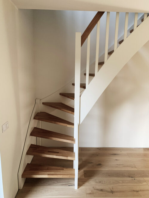 L-shaped staircase with oak steps. Materials - wood.