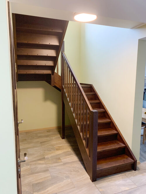 U-shaped staircase with LED lighting. Oak steps.