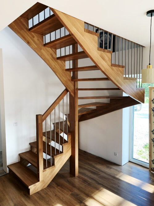 U-shaped staircase with metal baluster. Oak steps.