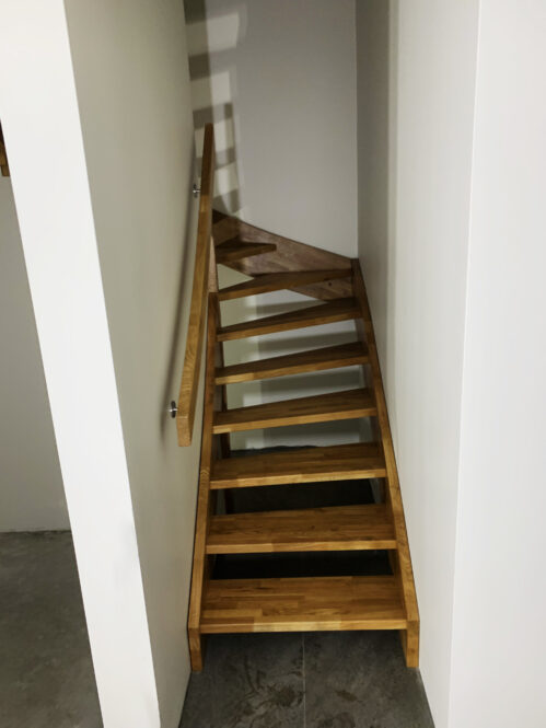 U-shaped staircase with oak steps. Light finish.