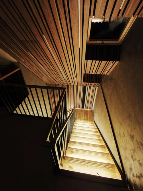 U-shaped staircase with anti-slip grooves. LED lighting.