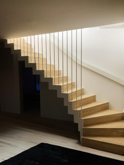 Designer staircase with oak steps. Light finish.