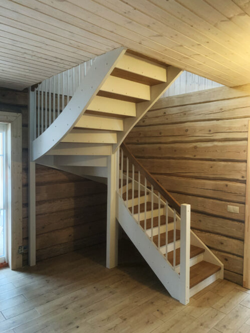 U-shaped staircase with light finish. Oak steps.