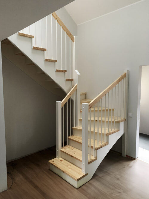 U-shaped staircase with modern stringers. Pine steps.