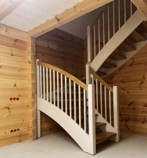 U-shaped staircase with light finish. Oak steps.