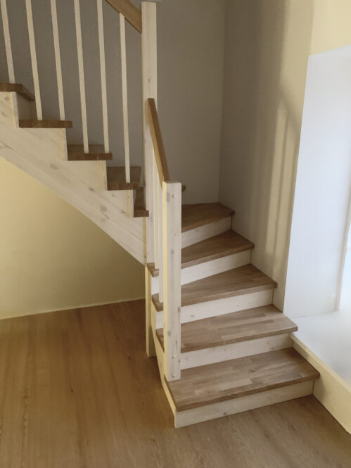 L-shaped staircase with light finish.