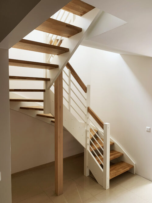 U-shaped staircase with oak steps. Light finish.