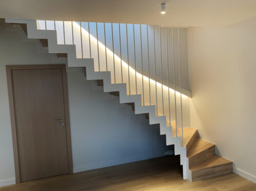 L-shaped design staircase with LED lighting. Steps made of oak.