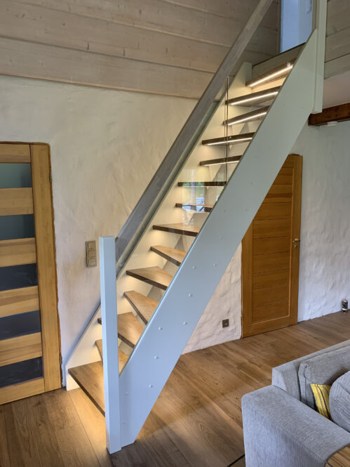 Design staircase with LED lighting. Steps made of oak.