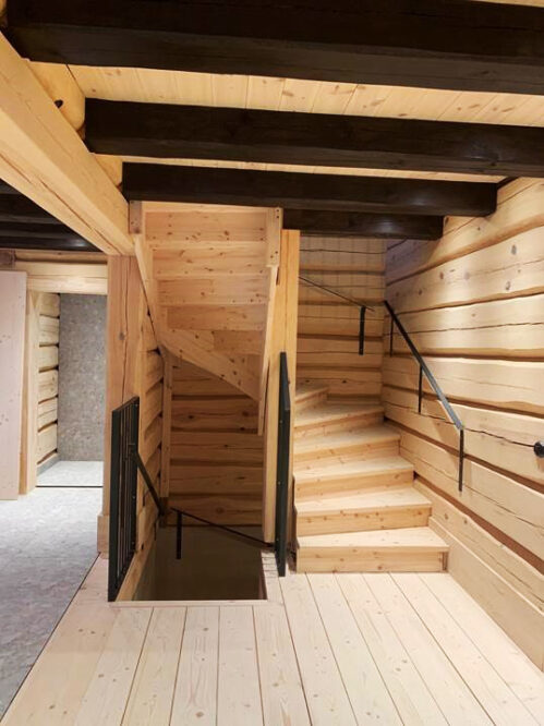 U-shaped staircase with pine steps. Modern stringer.