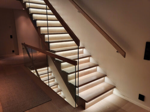 I-shaped designer staircase with oak steps and LED lighting.